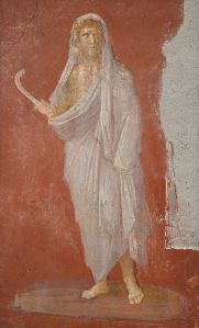 Saturn_with_head_protected_by_winter_cloak,_holding_a_scythe_in_his_right_hand,_fresco_from_the_House_of_the_Dioscuri_at_Pompeii,_Naples_Archaeological_Museum_(23497733210)